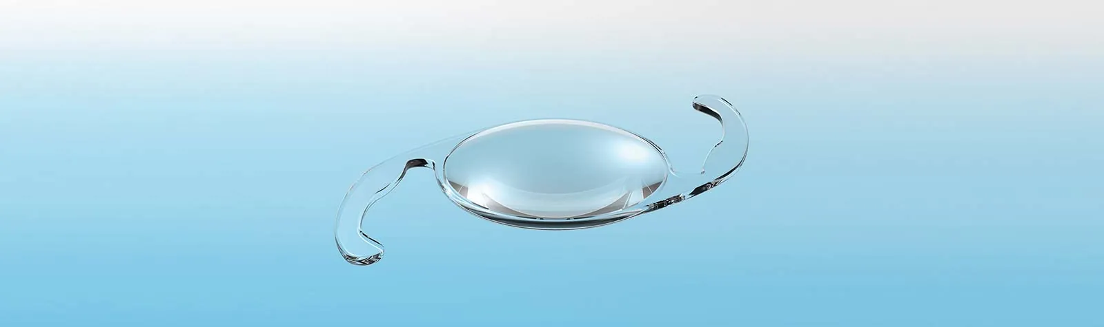 An intraocular lens implant against a blue background — banner photo from the current lifestyle lenses page