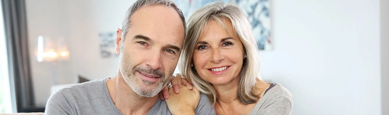 A smiling older couple — banner photo from the current LRI eye surgery page